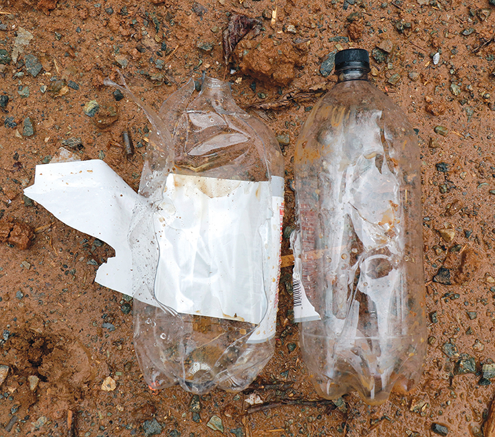 Bottle on the left was hit with a 44 WCF with a 200-grain, hollow-point bullet from a rifle at 20 yards, and the bottle on the right was hit with a 200-grain solid at about the same velocity.
